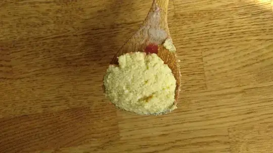 A cooking spoon with soy pulp
